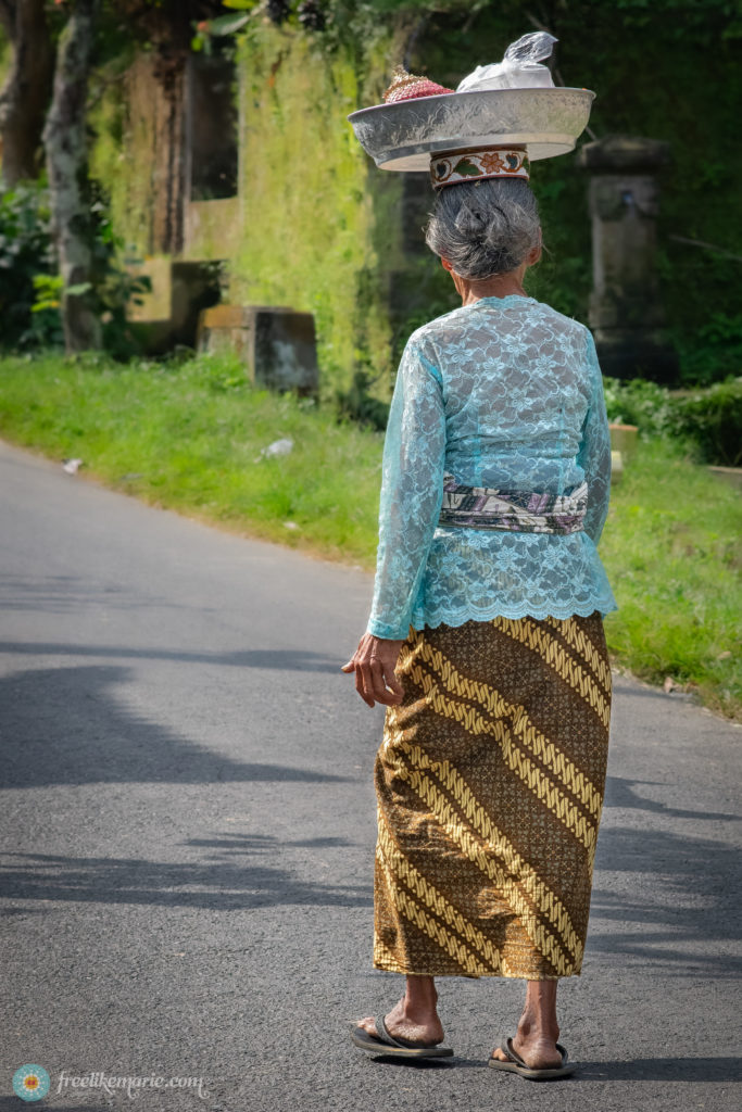 Balinese Woman Carrying Offering Goods to the Temple