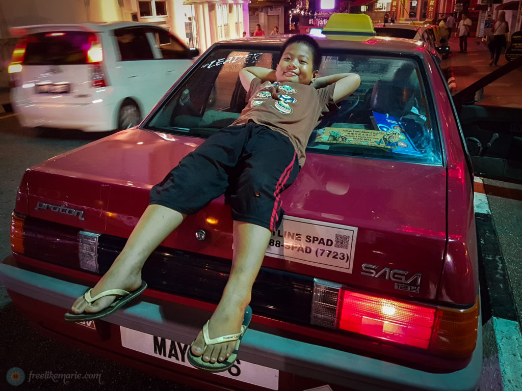 Boy on a Car in Melaka Malaysia
